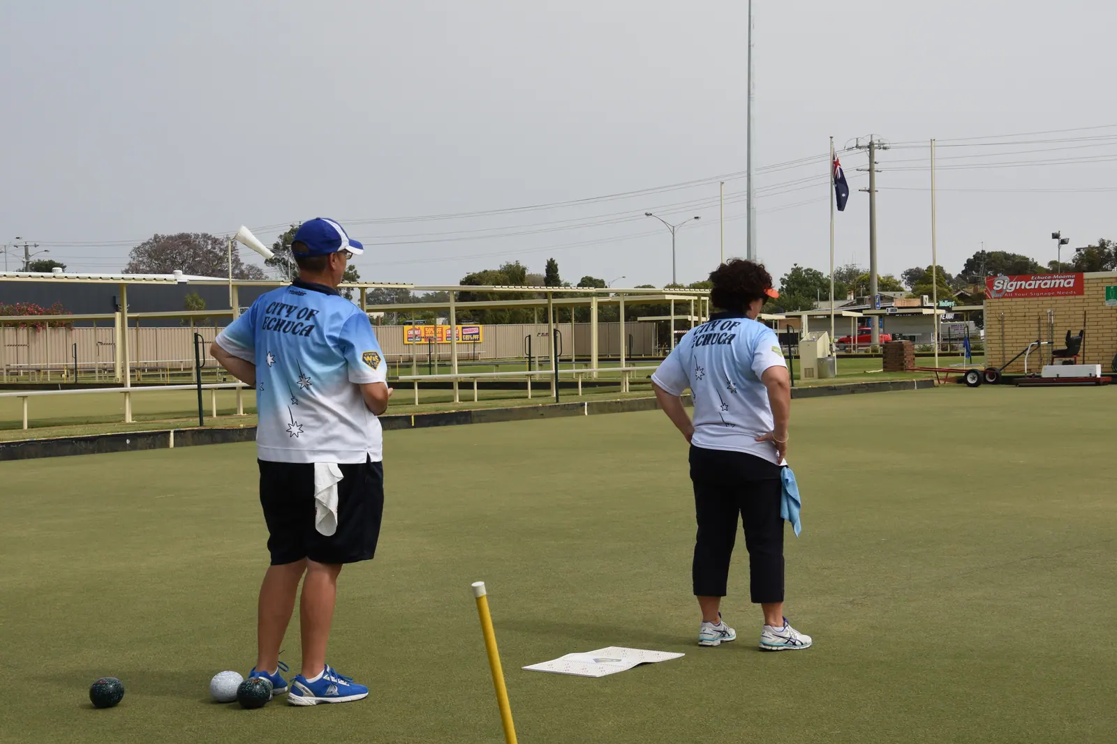 Two players measuring up to the mat during a championship match