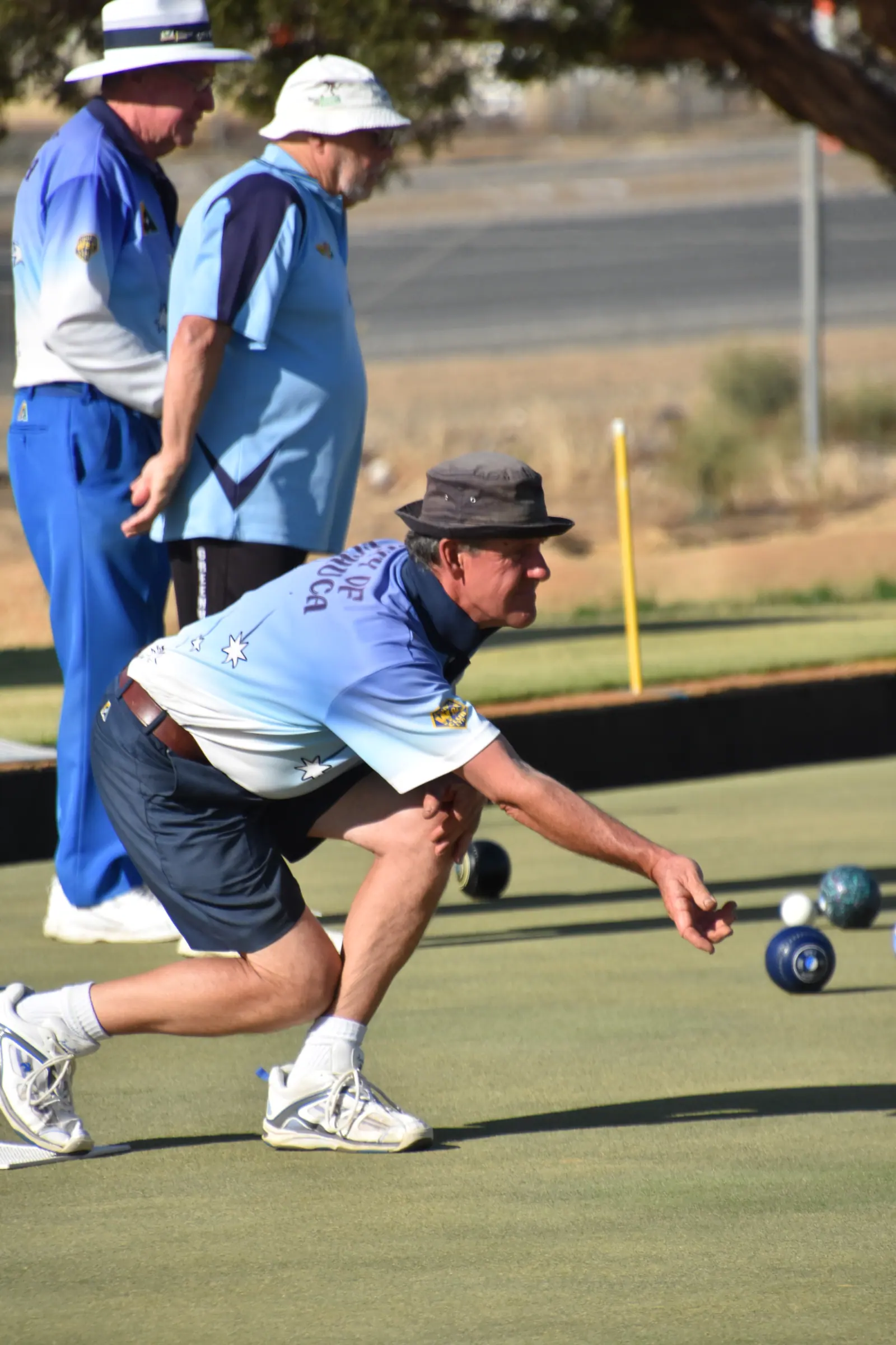 A bowler following through after delivery during tournament play