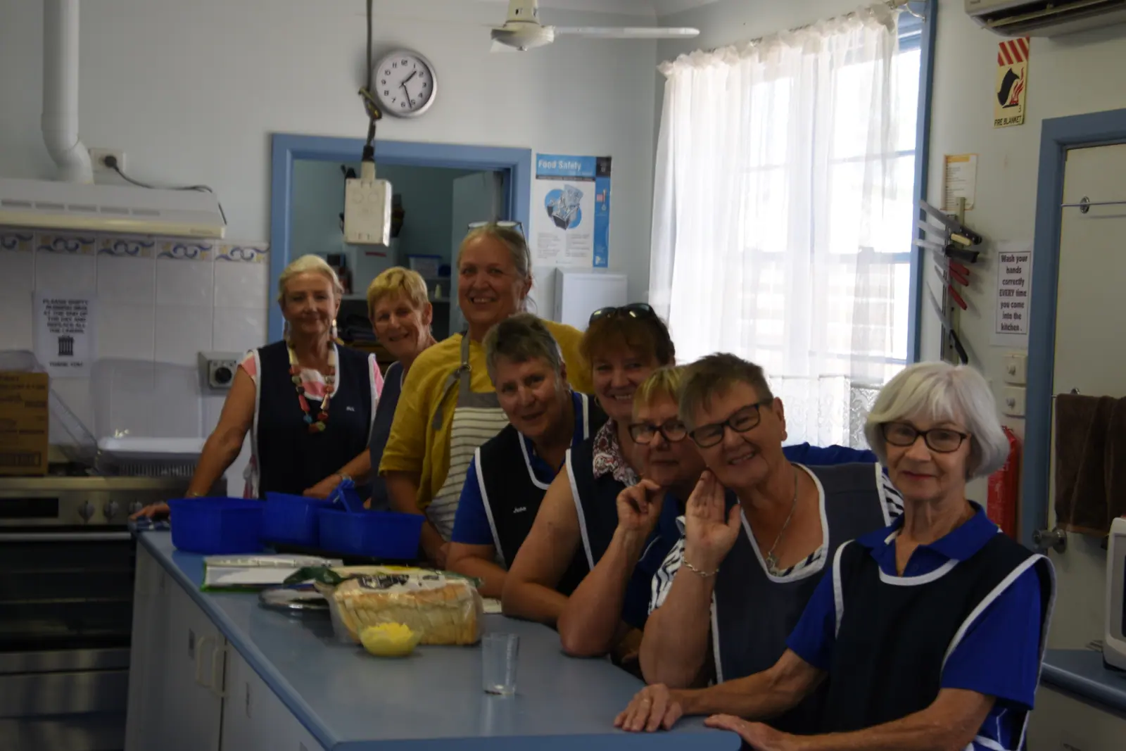 Volunteers preparing catering in the Echuca Bowls Club kitchen